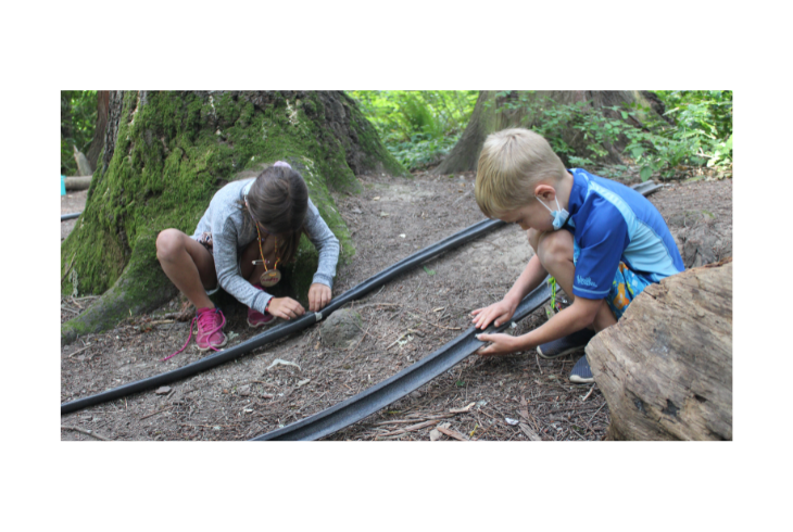 Campers at the Tualatin Hills Nature Park and Cooper Mountain are not just visitors but active participants in a world that unfolds around them. Campers spend time outdoors, making friends, and learning new things. Children in this photo are experimenting with STEM models.     