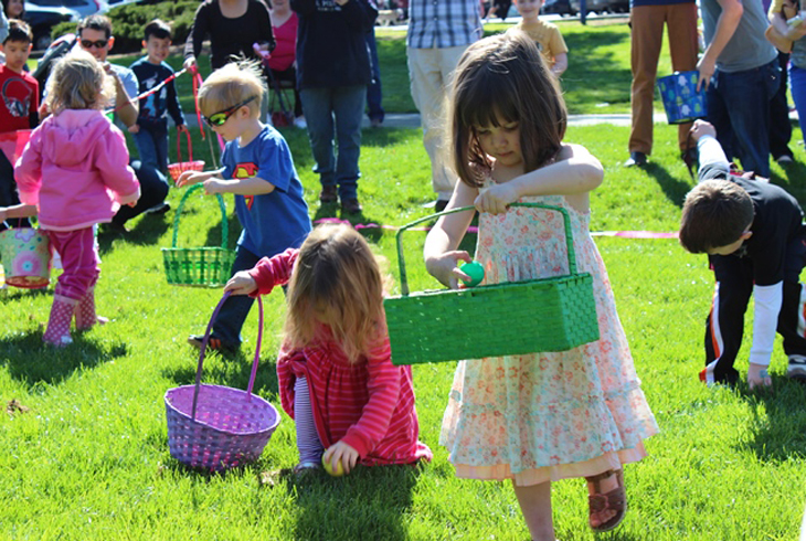 Kids (ages 1 to 10) swarm the field behind Garden Home Recreation Center in search of eggs at the annual Spring Egg Hunt.
