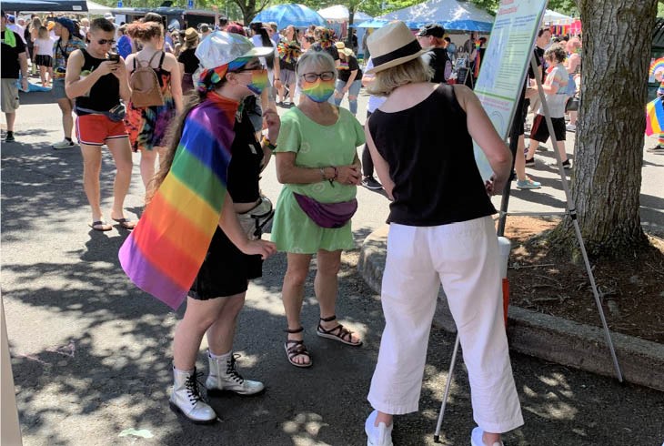 Staff tabling at Pride Event for Downtown Parks Plan